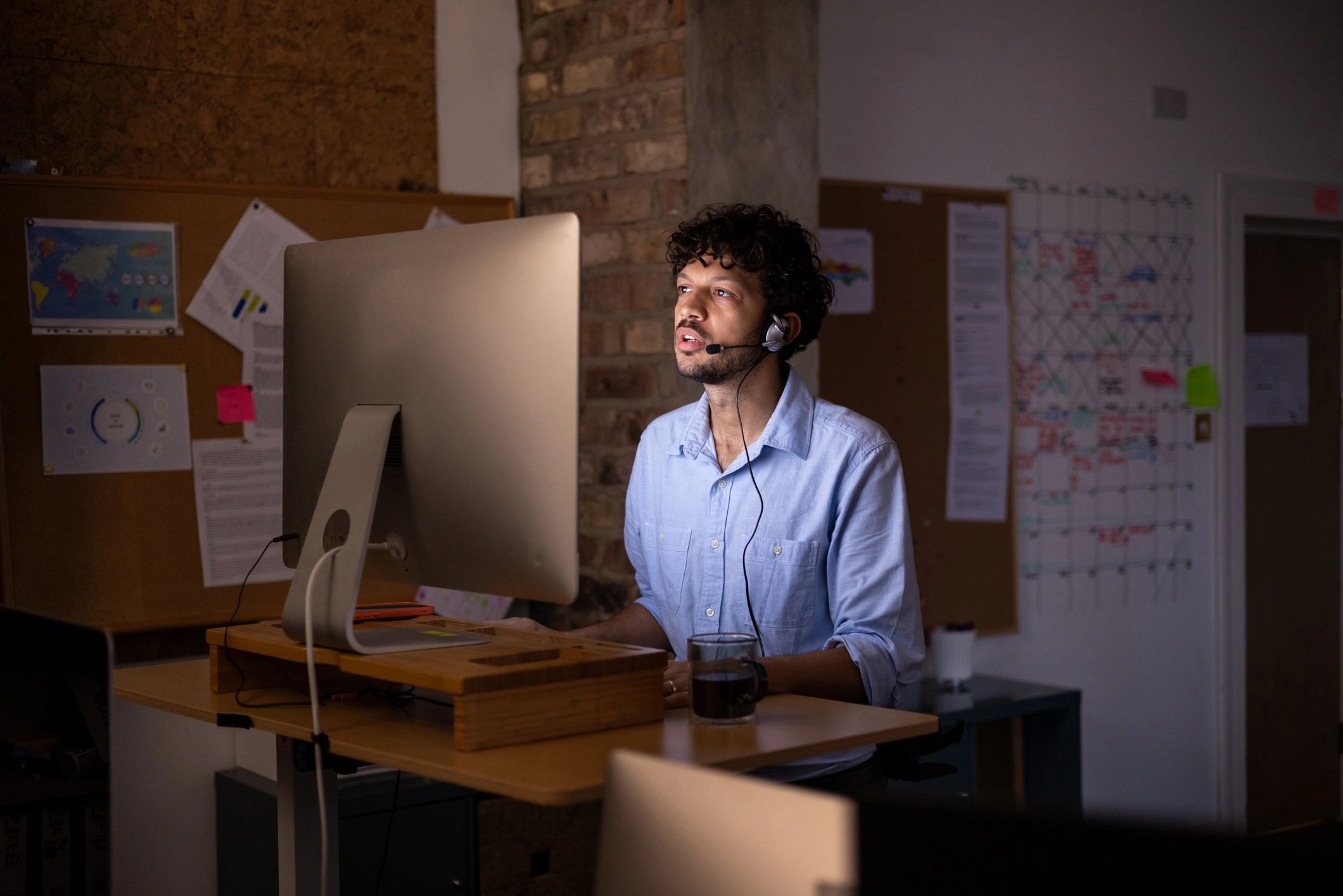 Person working at a computer desk